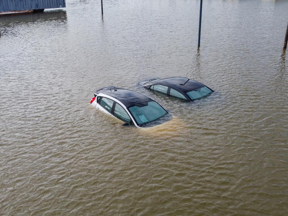 An aerial view of severe flooding in Frankfort, Kentucky, caused by days of heavy rainfall on April 7, 2025. Violent storms battering the central-eastern United States killed at least 17 people. The storms came as the National Weather Service was grappling with nearly 600 job cuts by the Trump administration. Now, the NWS has been given authorization to rehire more than 100 forecasters, radar technicians and others.