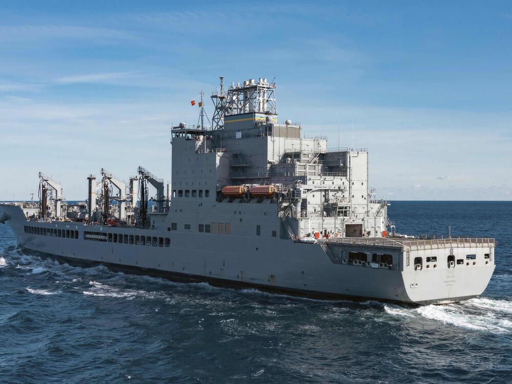 In this image provided by the U.S. Navy, the John Lewis-class replenishment oiler USNS Harvey Milk (T-AO-206) conducts a replenishment at sea in the Atlantic Ocean, Dec. 13, 2024.