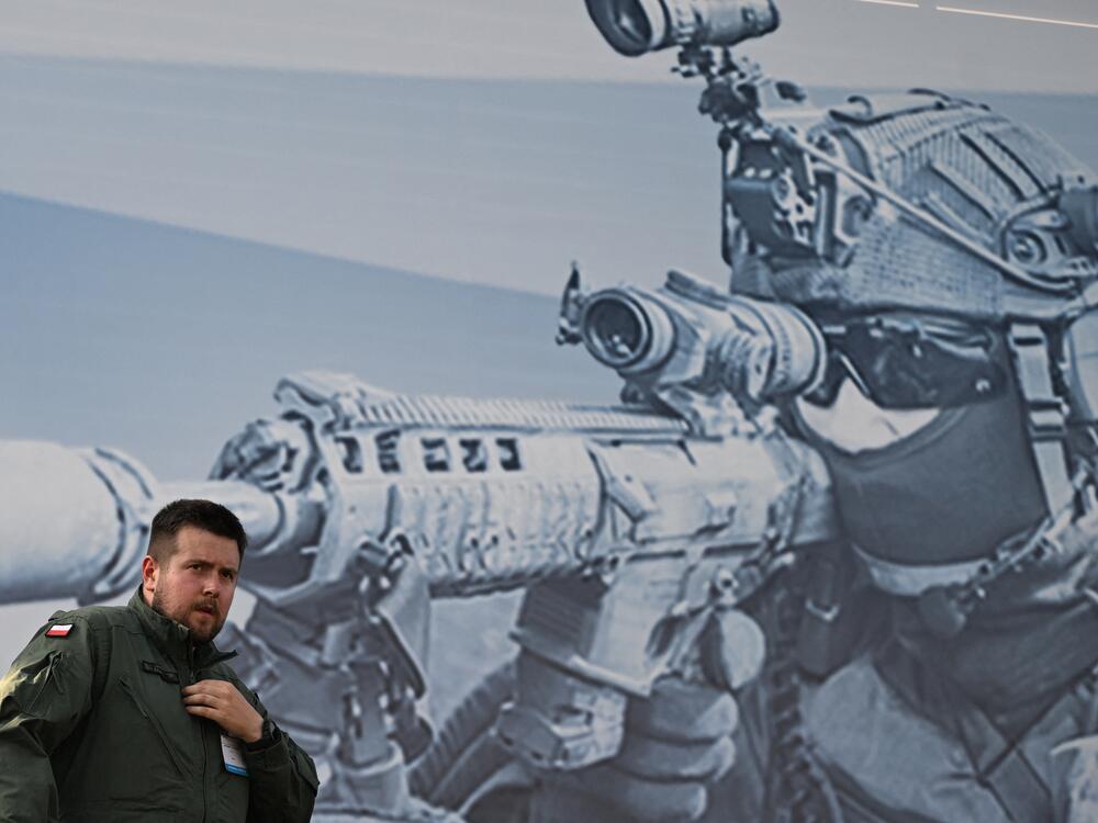 A Polish serviceman stands on an Abrams M1A1 tank during the 2024 International Defence Industry Exhibition in Kielce, Poland, on Sept. 3, 2024. Poland and Germany are among the countries aiming to transform their militaries to meet the challenge presented by Russia.
