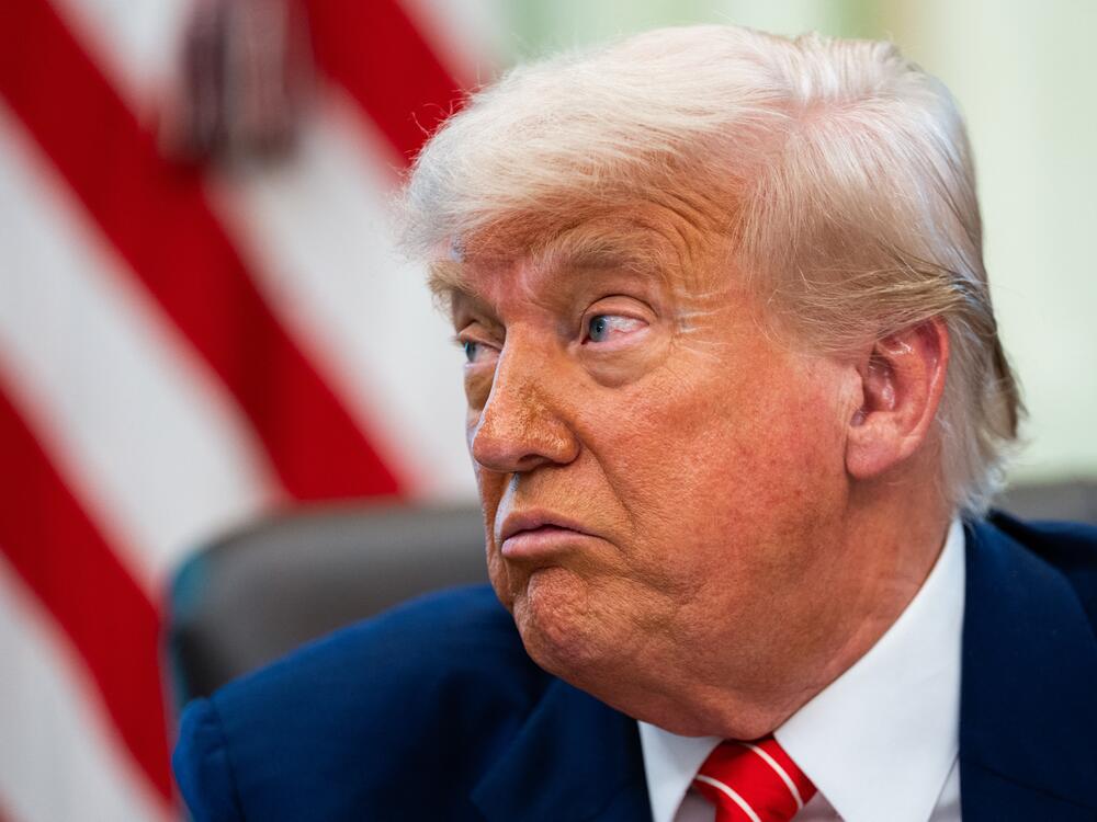 President Trump speaks during a news conference in the Oval Office of the White House in Washington.