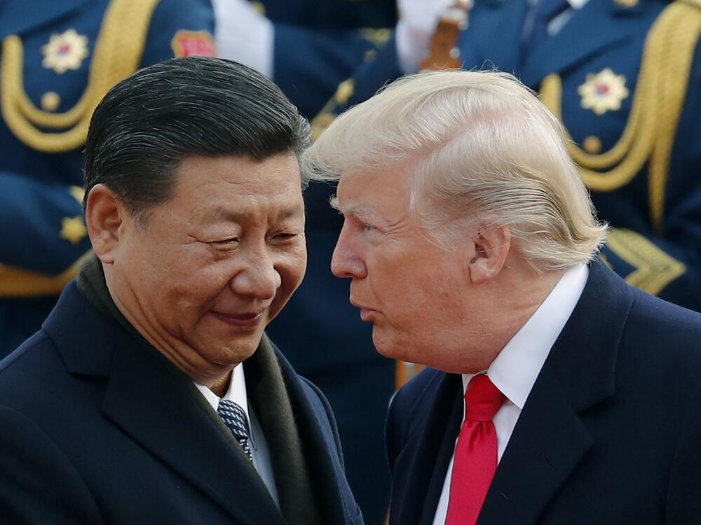 President Trump chats with Chinese President Xi Jinping during a visit to Beijing in 2017.