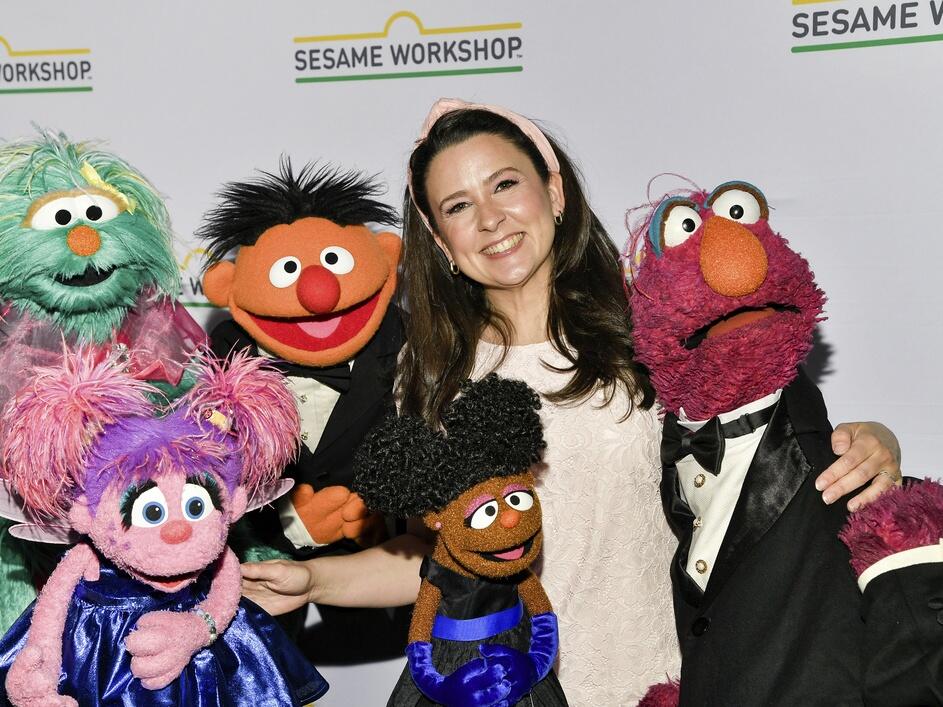 Rachel Accurso, aka Ms. Rachel, poses with Muppet characters at the Sesame Workshop benefit gala May 29 at Cipriani 42nd Street in New York.