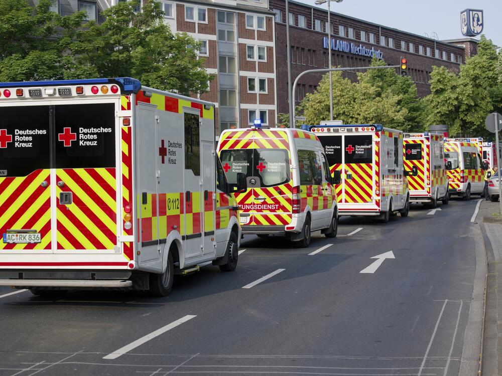 Ambulances drive to the Eduardus Hospital in Cologne-Deutz to evacuate the hospital before specialists defuse three unexploded U.S. bombs from World War II that were unearthed earlier this week in Cologne, Wednesday, June 4, 2025.