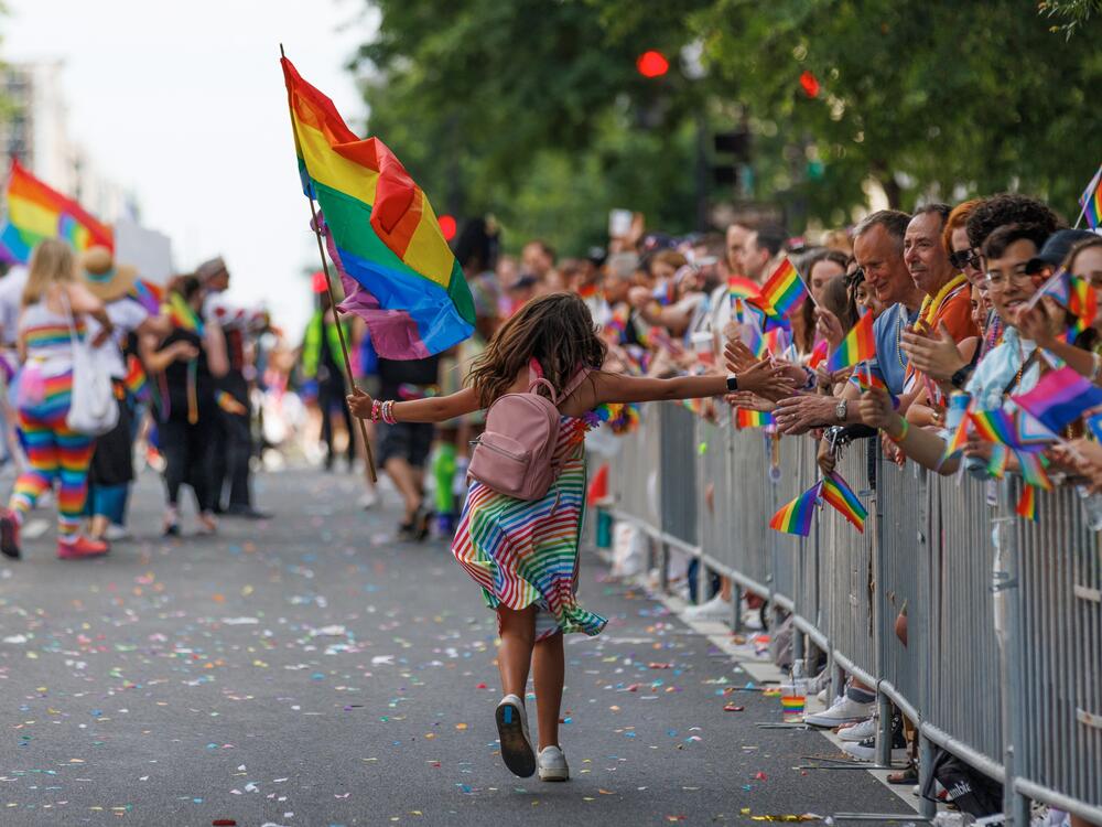 Participants march through the DC Pride Parade on Saturday, June 8, 2024 in Washington, District of Columbia in Logan Circle.