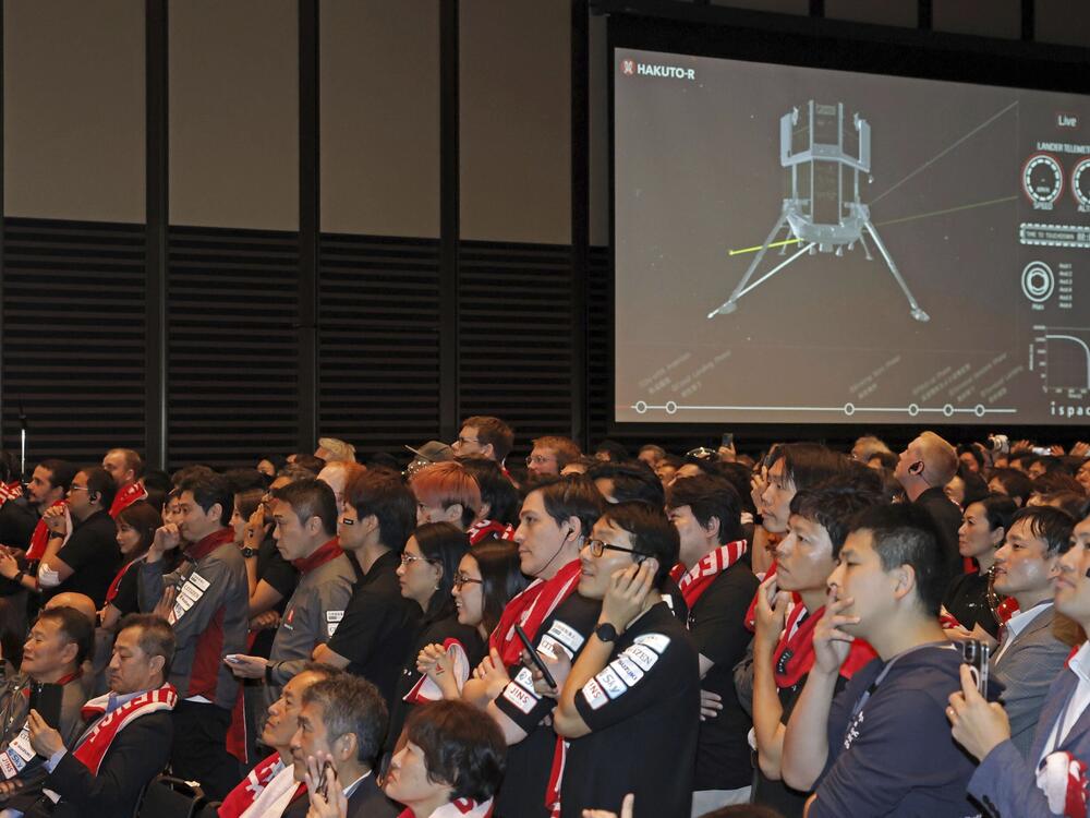 People await the update on ispace's private lunar lander's attempt to touch down on the moon Friday, June 6, 2025, in Tokyo, Japan.