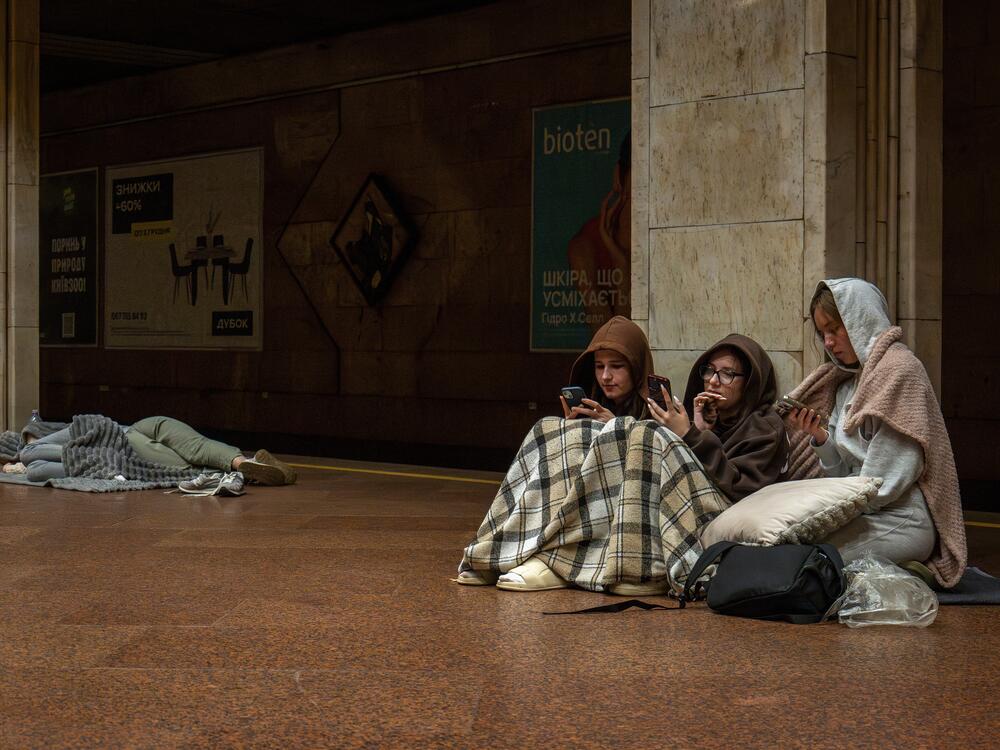 People rest in a metro station, being used as a bomb shelter, during a Russian drones attack in Kyiv, Ukraine, early Friday.