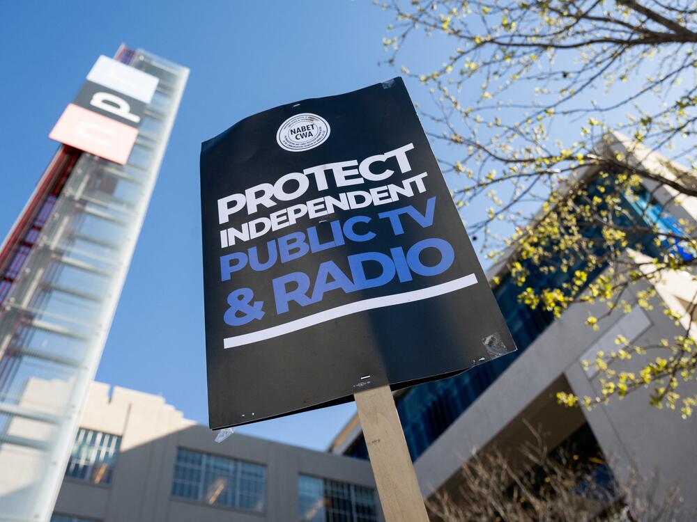 People participate in a rally to call on Congress to protect funding for US public broadcasters, Public Broadcasting Service (PBS) and National Public Radio (NPR), outside the NPR headquarters in Washington, DC, on March 26, 2025.