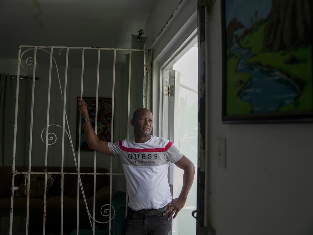 Juan Vega Paredes, a Dominican man who was arrested by immigration authorities in Puerto Rico in January, poses for a portrait in his home in San Juan, Puerto Rico on June 3, 2025.