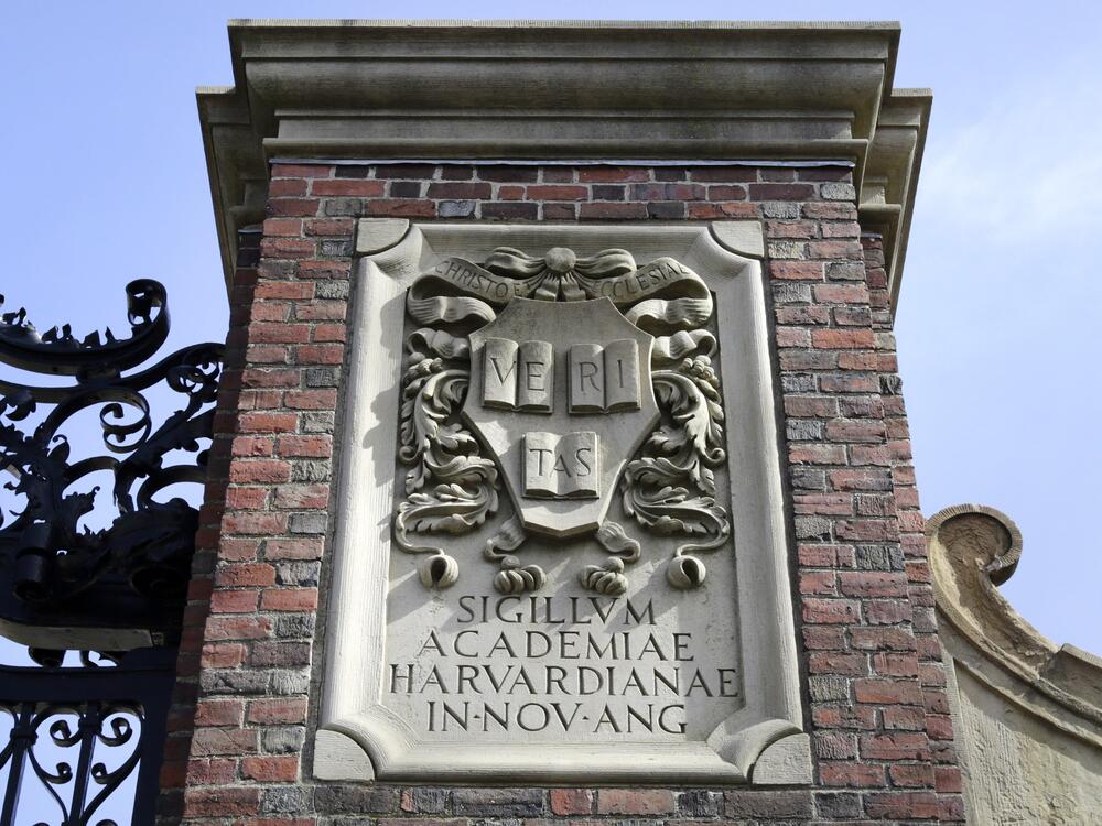 A relief sculpture rests on a gate to the entrance of Harvard University, in Cambridge, Mass., March 13, 2016.
