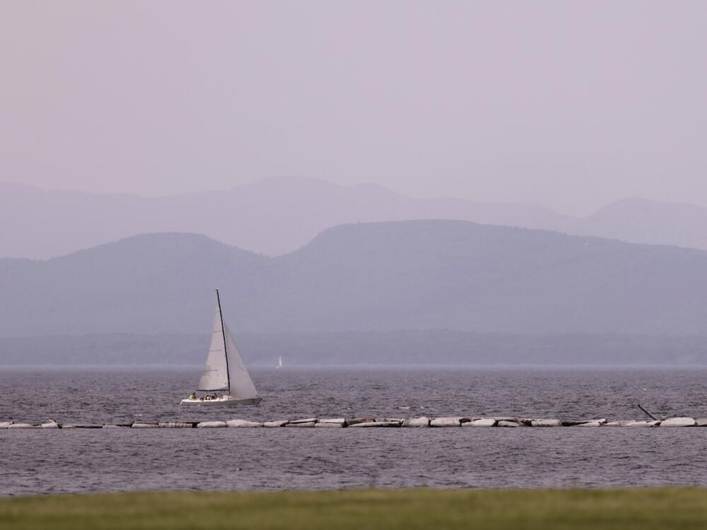 Hazy skies due to smoke from wildfires in Canada are seen over Lake Champlain and the Adirondack Mountains on Wednesday in Burlington, Vt.