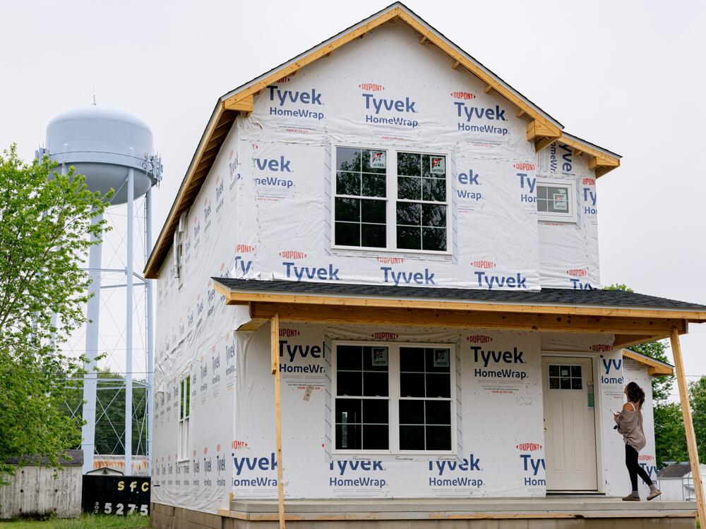 Becca Morris stands on the front porch of her future home, in Harrington, Delaware.