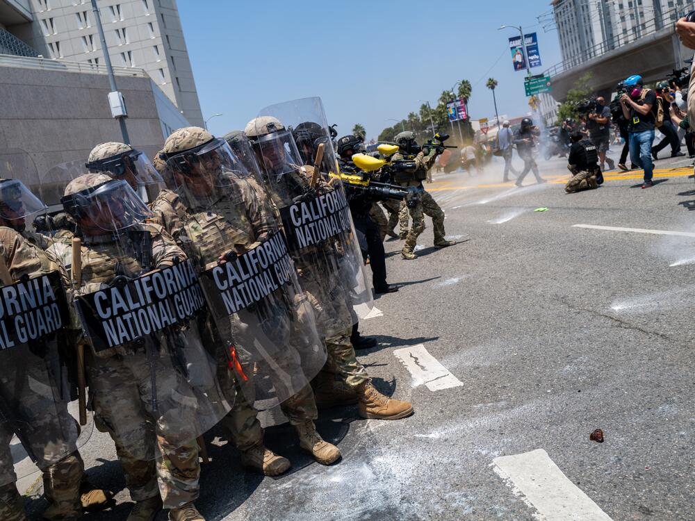 The National Guard, police and protesters stand off outside of a downtown jail in Los Angeles on Sunday following days of clashes with law enforcement over immigration raids.