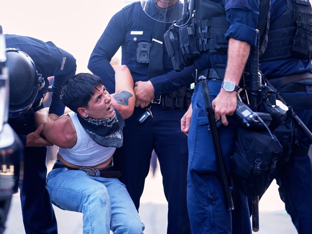 A protester is detained in downtown Los Angeles.