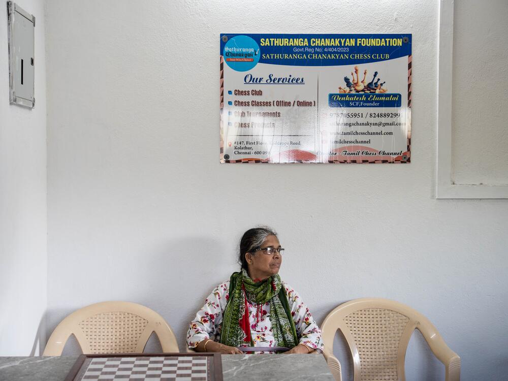 Nafeez Hussain, whose child studies with chess trainer Venkatesan Enumalai, sits in the waiting area of the Sathuranga Chanakyan Chess Club in Chennai. Family members sometimes spend hours there while their children learn the intricacies of the ancient game.