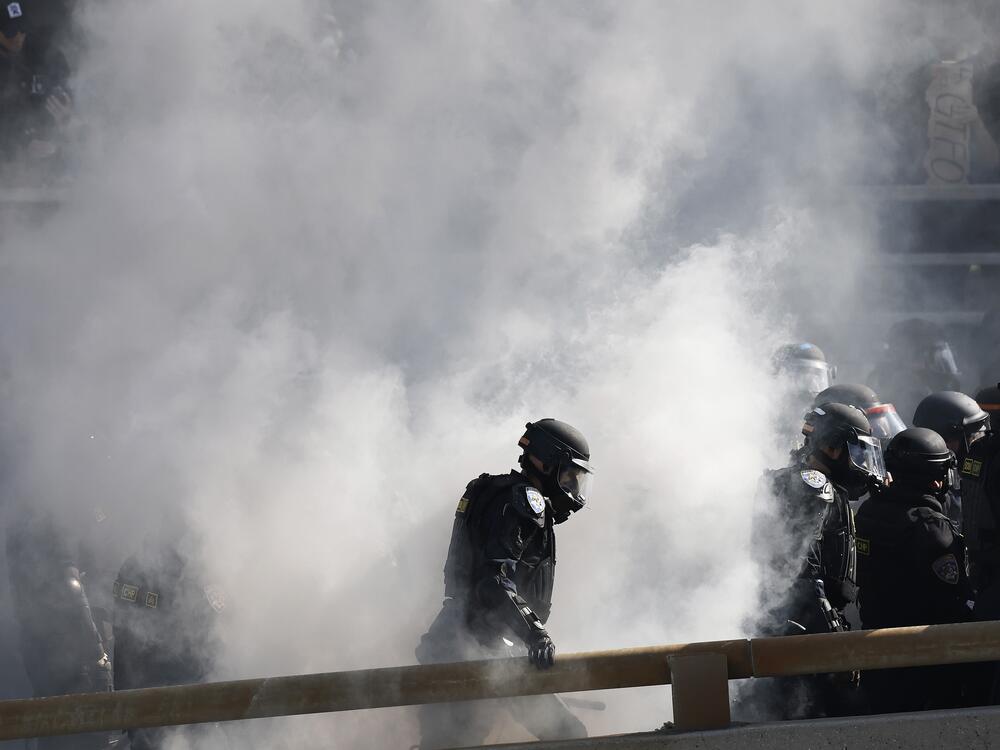 California Highway Patrol officers clear protestors on the 101 freeway as tensions in the city remain high after the Trump administration deployed the National Guard against the wishes of state and city leaders. The deployment follows two days of clashes with police during a series of immigration raids.