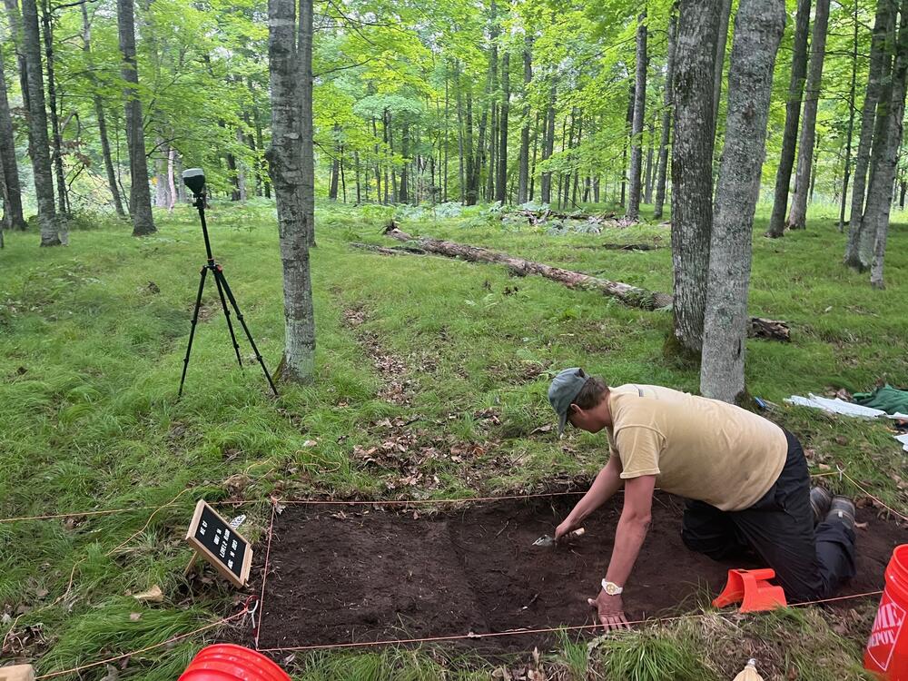 Jonathan Alperstein, one of the researchers, excavates a portion of land on an ancient agricultural site in Michigan.