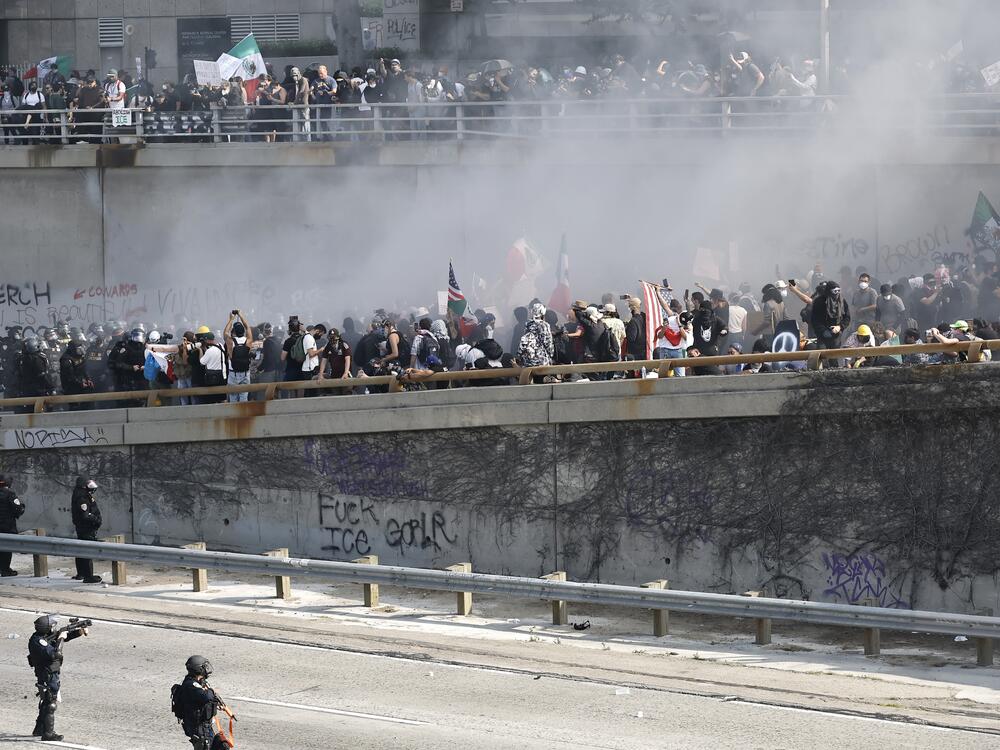California Highway Patrol officers work to clear protesters blocking the 101 freeway on June 8, 2025, in Los Angeles.
