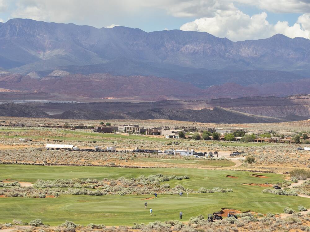 Golfers play a round on the manicured landscape of a Washington County golf course. In this desert climate, irrigated grass can be a significant strain on the local water supply. That's why the county has introduced incentives and regulations in an effort to increase water conservation.