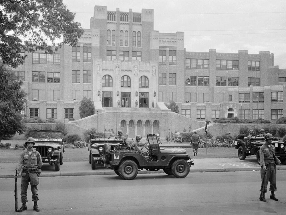 Members of the 101st Airborne Division take up positions outside Central High School in Little Rock, Ark., on Sept. 26, 1957. The troops were on duty to enforce integration at the school.