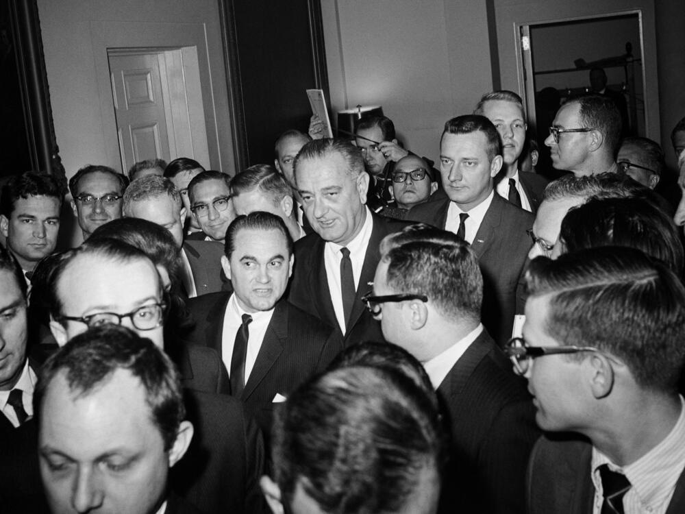 March 13, 1965: President Lyndon B. Johnson, center, and Alabama Gov. George Wallace (second left) are surrounded by reporters in the White House after meeting to discuss events in Selma, Ala. One week later, Johnson would federalize Alabama's National Guard to protect a civil rights march.
