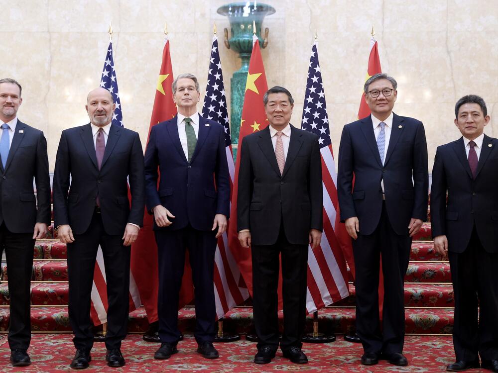Chinese Vice Premier He Lifeng, center right, and U.S. Treasury Secretary Scott Bessent, center left,  with their delegations before their meeting to discuss U.S.-China trade in London on Monday. Talks are continuing Tuesday.