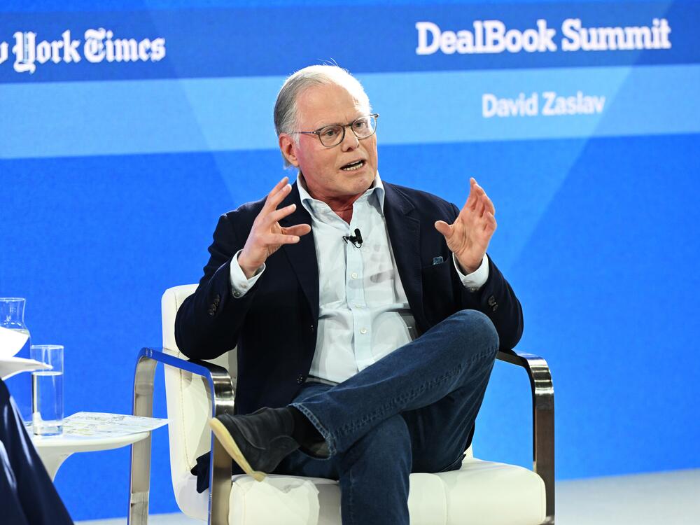 Warner Bros. Discovery chief David Zaslav, shown at a <em>New York Times</em> event in 2023, announced on Monday that the company would be split, with its streaming and Hollywood studios on one side, and its cable properties on the other. The company currently includes HBOMax, Warner Bros. movie and television studios, and CNN among its properties.