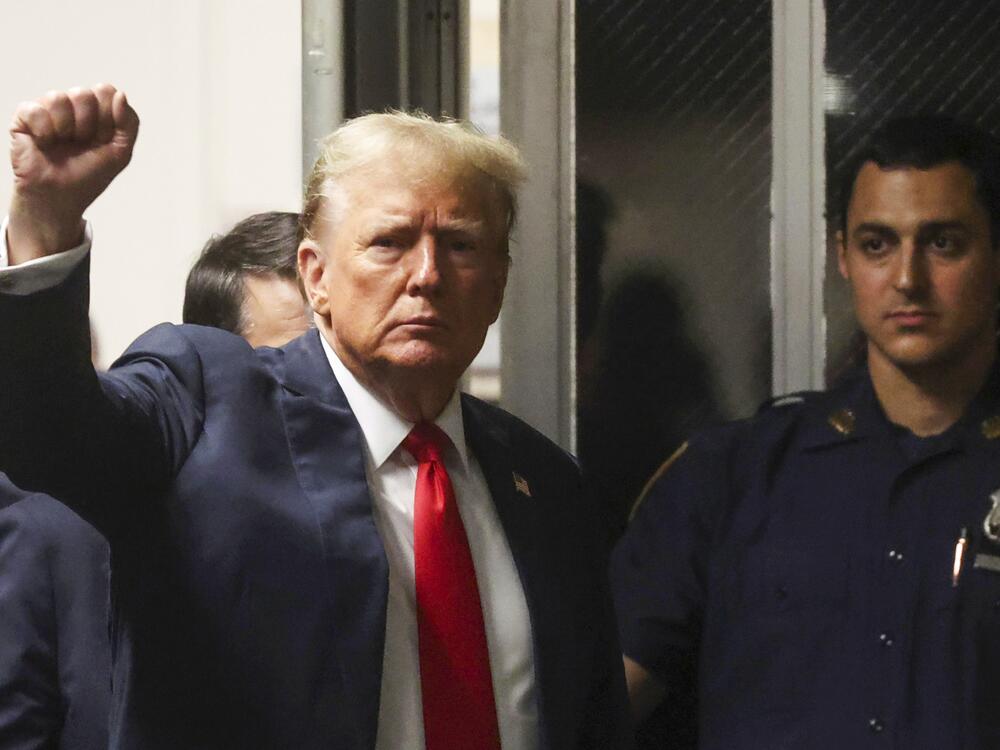 President Trump, shown at Manhattan criminal court in New York, May 28, 2024, before he was re-elected, reacts as he walks back into the courtroom after a break during closing arguments in his hush money trial.