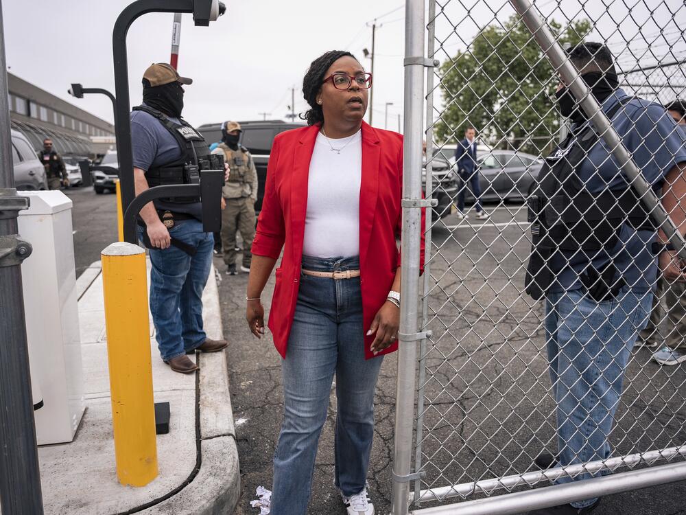 Rep. LaMonica McIver, D-N.J., walks through a security gate at the Delancey Hall immigration detention center in Newark, N.J., on Friday, May 9. The member of Congress now faces federal charges stemming from her visit to the facility that day.
