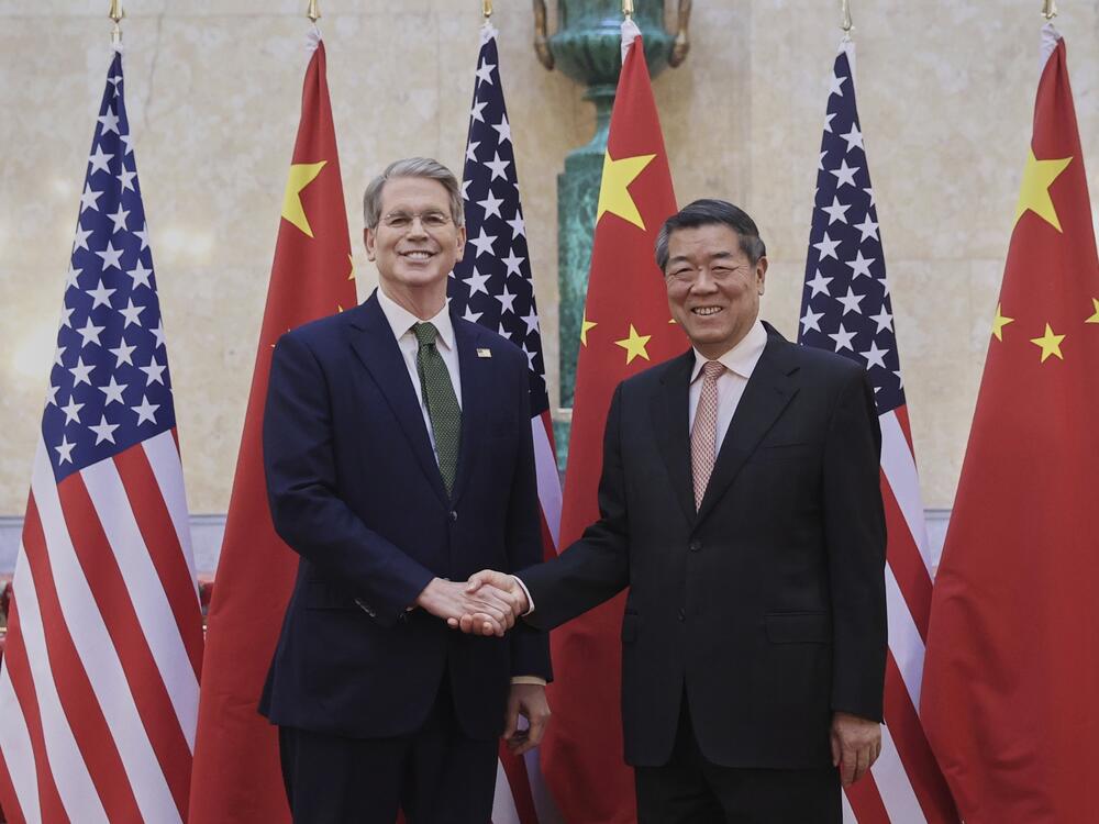 In this photo released by Xinhua News Agency, Chinese Vice Premier He Lifeng (right) shakes hands with U.S. Treasury Secretary Scott Bessent before their meeting to discuss China-U.S. trade, in London on Monday.
