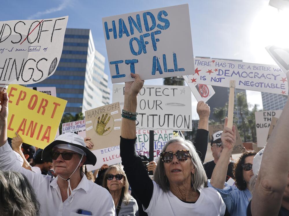 Protesters march during a 'Hands Off!' protest against the Trump administration on April 5 in Los Angeles.