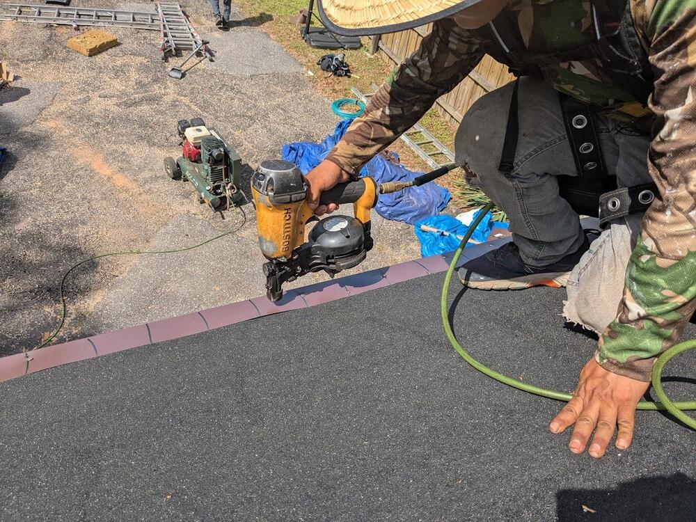Contractors install a roof in Mobile County, Ala., designed to better withstand hurricanes. Other states are adopting similar programs, offering insurance discounts to encourage disaster preparation.