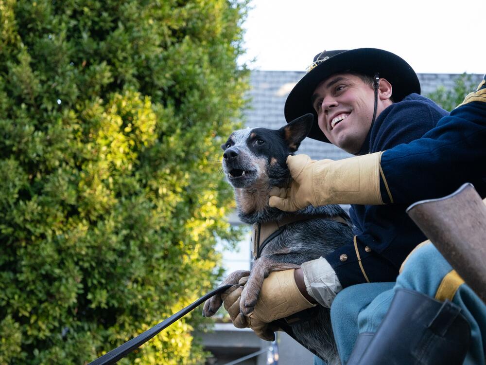 Army Spc. Ronaldo Mendez poses with Doc Holliday before the Rose Parade in Pasadena, Calif. on Jan. 1.