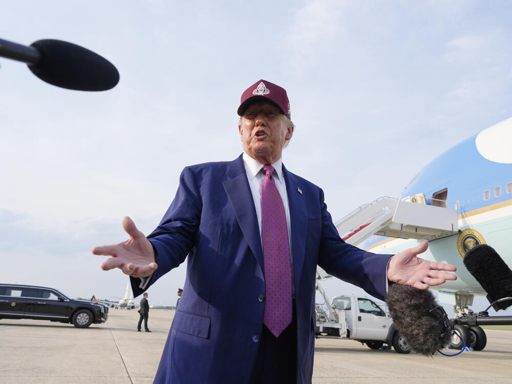 President Trump speaks to reporters after arriving on Air Force One on Tuesday at Joint Base Andrews, Md.