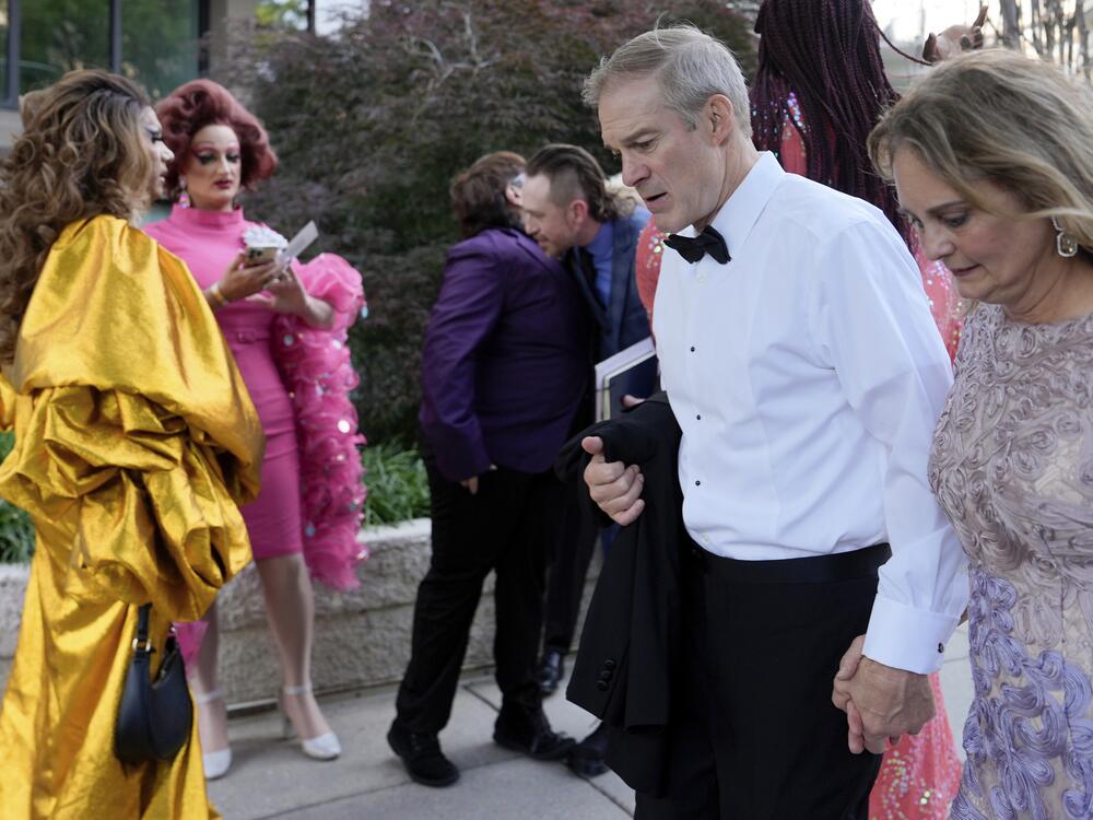 Rep. Jim Jordan, R-Ohio, and Polly Jordan walk past Tara Hoot, Ricky Rosé, Vagenesis and Maria Con Carne outside the Kennedy Center, to attend <em>Les Miserables</em>, Wednesday, June 11, 2025, in Washington, D.C.