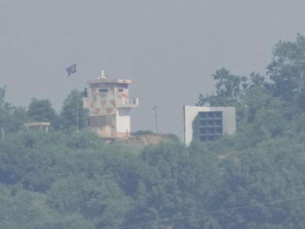 A North Korean military guard post, left, and loudspeaker are seen from Paju, South Korea, near the border with North Korea on Thursday.
