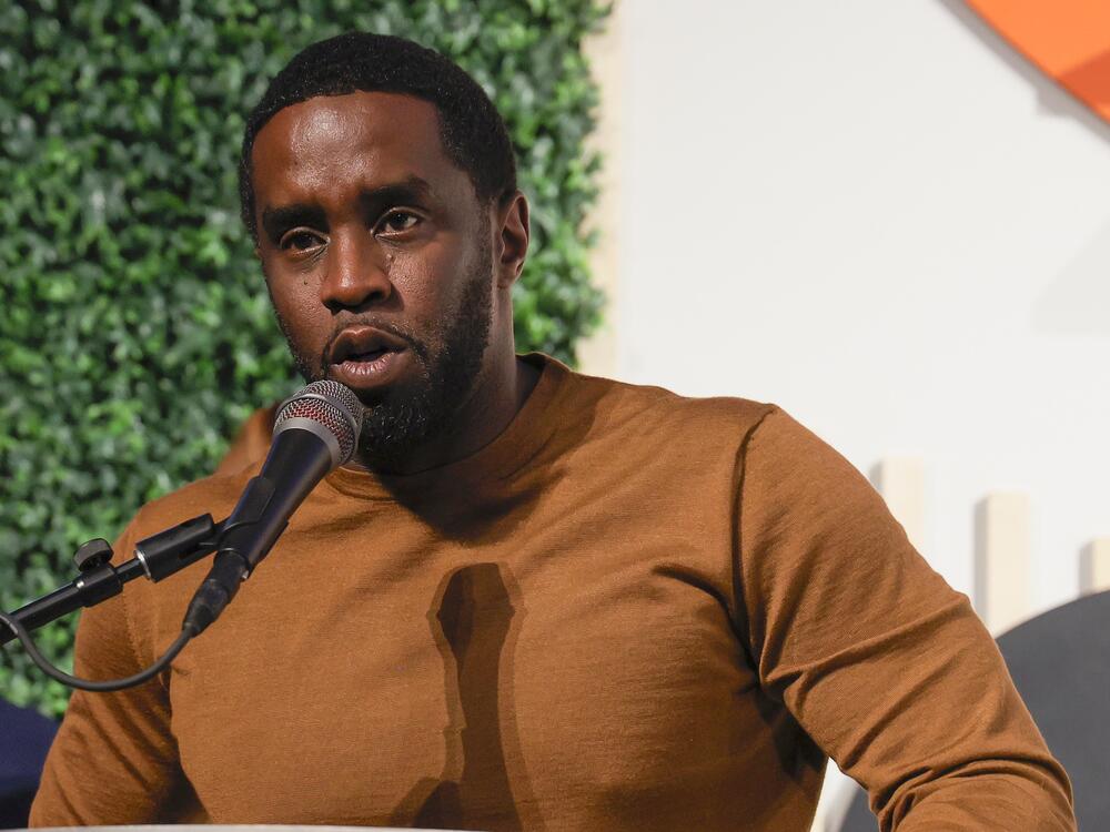 Sean Combs, shown speaking in Washington, D.C., in 2023, faces federal criminal charges that include racketeering conspiracy and sex trafficking. He has pleaded not guilty.