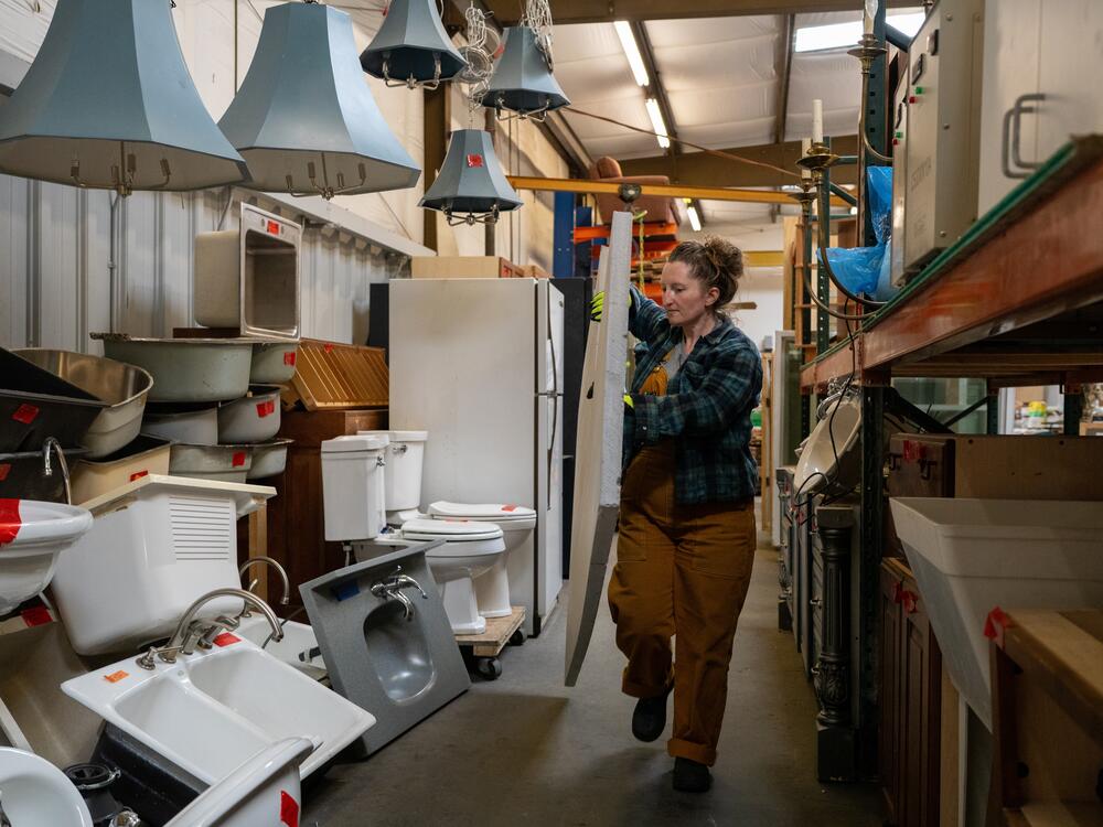 Scout Wise, a Perks Deconstruction warehouse coordinator, walks through the company's warehouse.