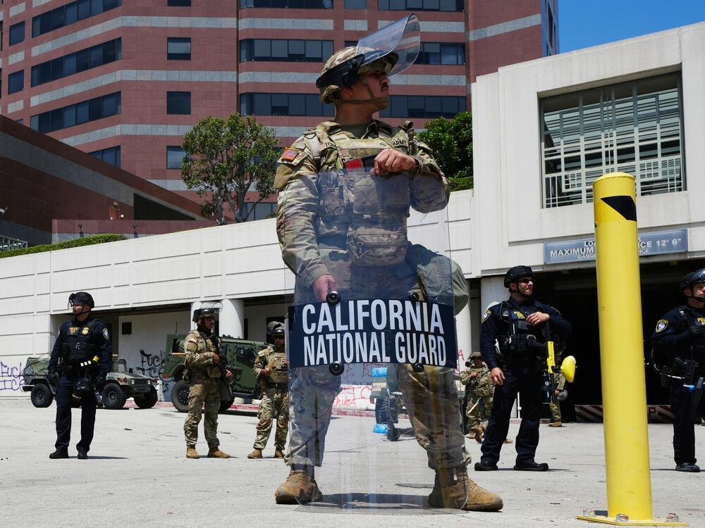 National Guard stand outside buildings this week in Los Angeles.