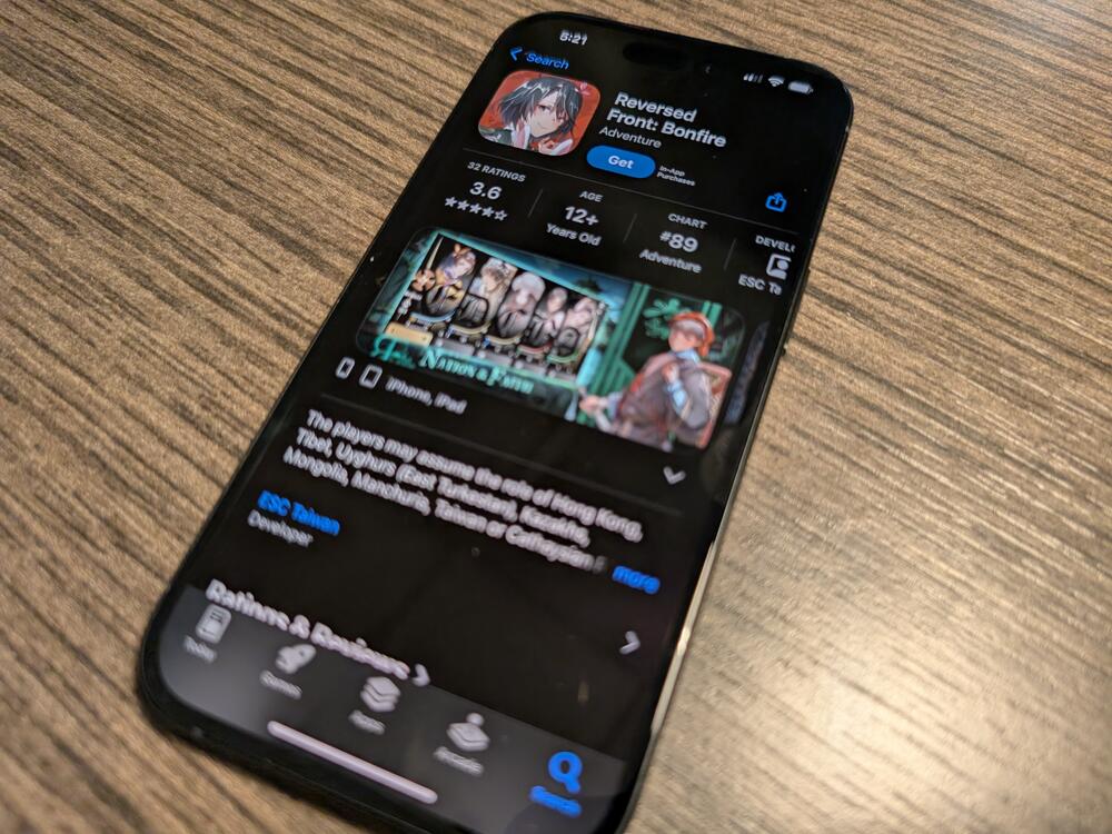 A phone displaying the App Store page for the mobile game Reversed Front: Bonfire.