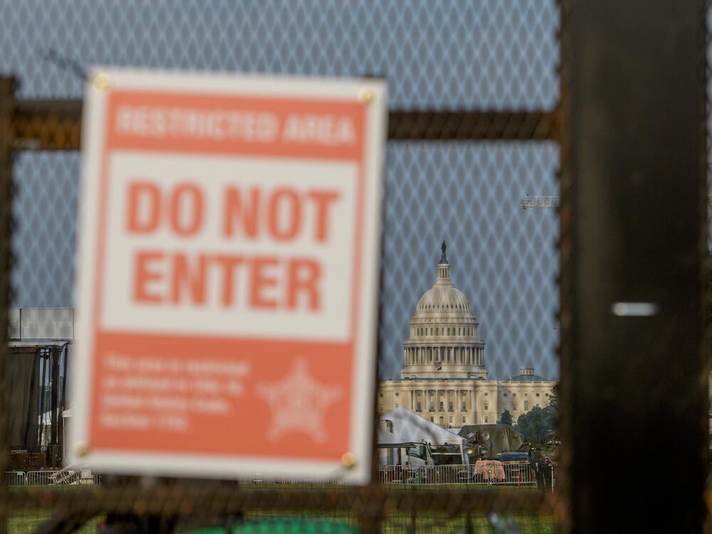 The U.S. Capitol is seen through security fencing, set up on the National Mall, during preparations for an upcoming military parade commemorating the Army's 250th anniversary and coinciding with President Donald Trump's 79th birthday, Thursday, June 12, 2025, in Washington.