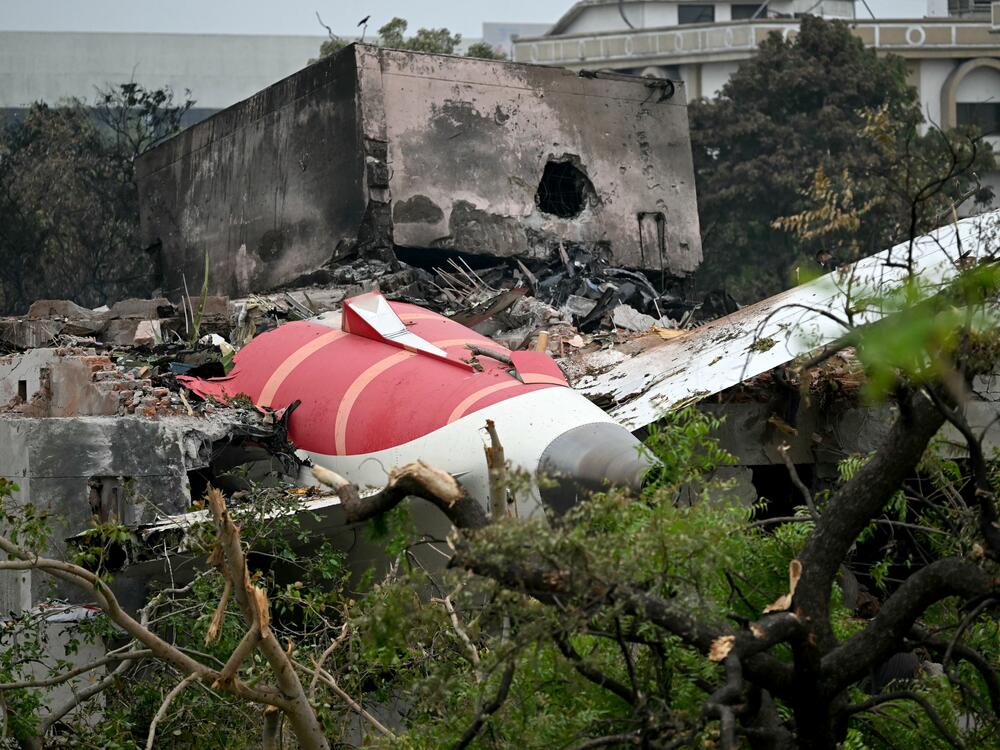 Debris of Air India flight 171 is pictured after it crashed Thursday in a residential area near the airport in Ahmedabad. Rescue teams with sniffer dogs combed the crash site on Friday.
