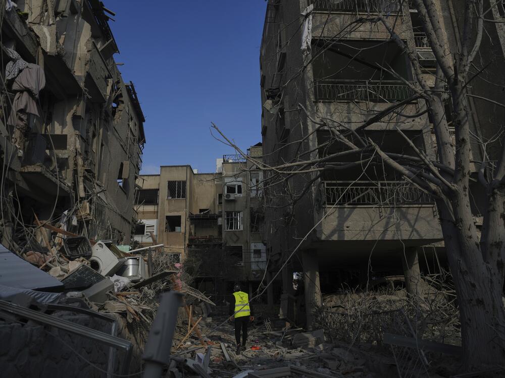 Israeli security forces on Saturday inspect destroyed residential buildings that were hit overnight by a missile fired from Iran, in Ramat Gan, near Tel Aviv, Israel.
