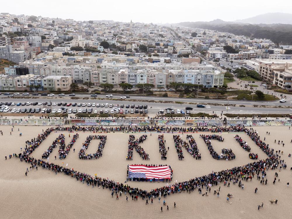 San Francisco: People form a human banner at Ocean Beach.