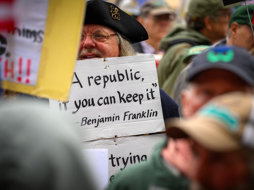 Hartford, Ct.: A person wearing a twi-corner hat and spectacles resembling those affiliated with Benjamin Franklin.