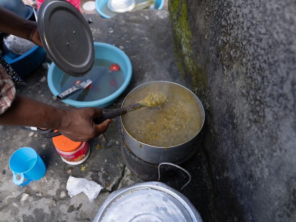 Outside Jennifer Mukuka's three-room house, where Diana now lives, Mukuka prepares a lunch of pumpkin leaves and groundnuts. Sometimes, Mukuka says, the family has only enough food to cook one meal a day of beans and a maize porridge called nshima.