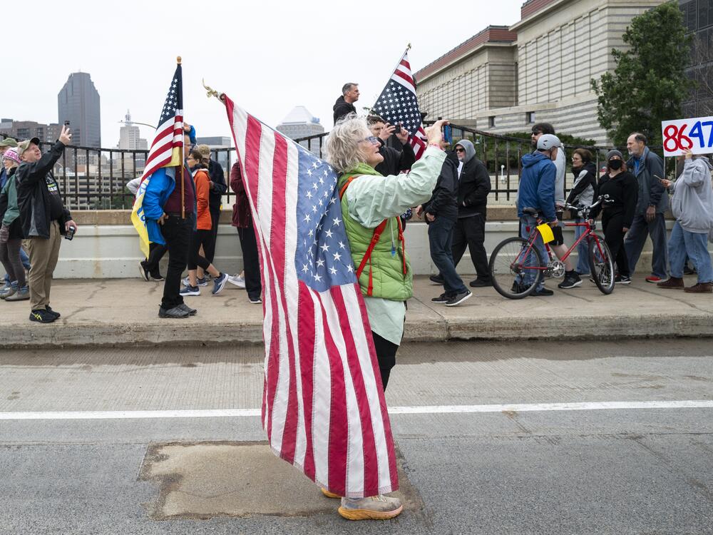 St. Paul: People take photos as demonstrators march to the Minnesota State Capitol building.