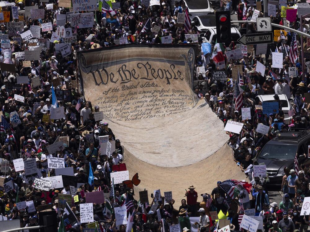 Los Angeles: Demonstrators deploy a giant banner reading 