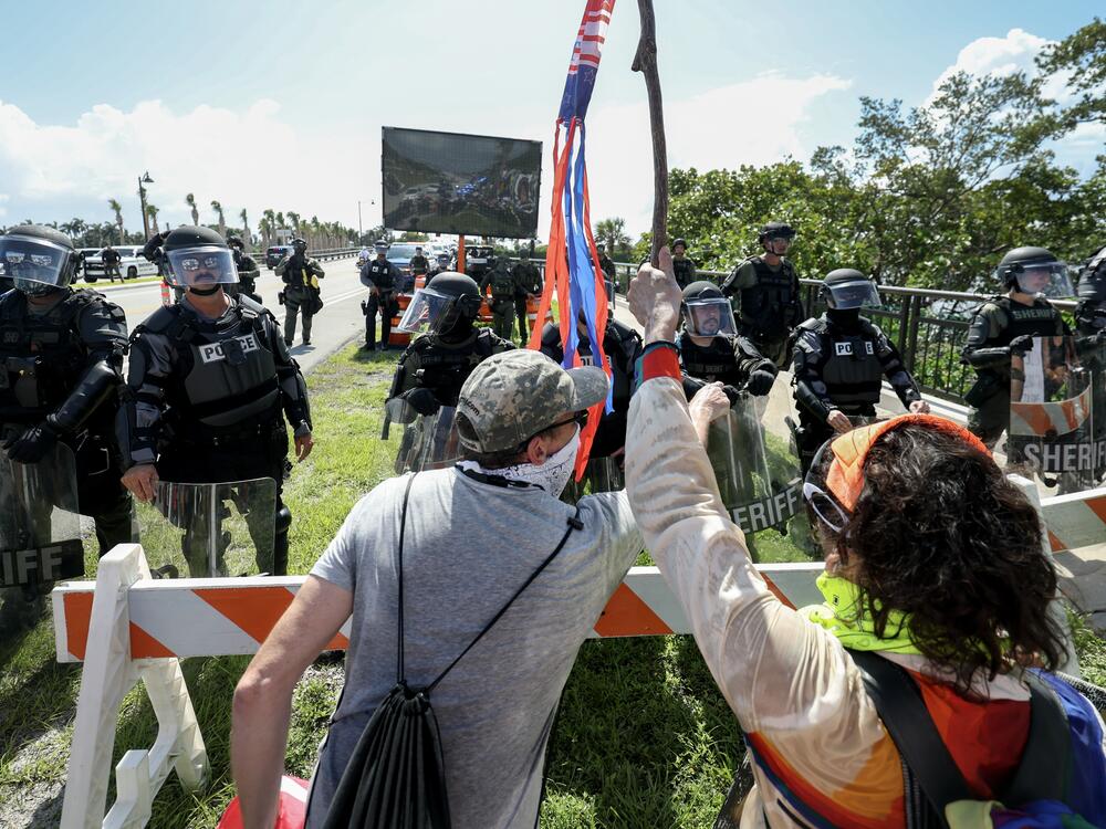 West Palm Beach, Fla.: Palm Beach Sheriff officers keep protesters from crossing a bridge to President Donald Trump's Mar-a-Lago home.