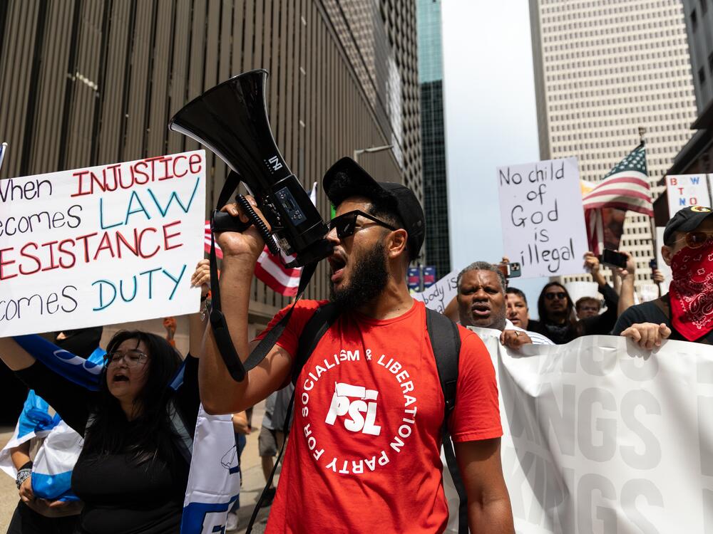 Houston: A protester shouts with a megaphone at No Kings protest.