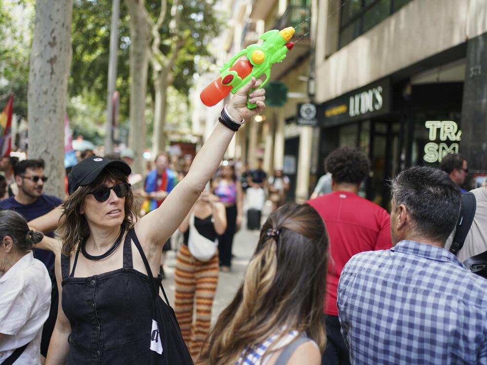 A protester with a water gun takes part in a protest against overtourism in Barcelona, Spain on Sunday.